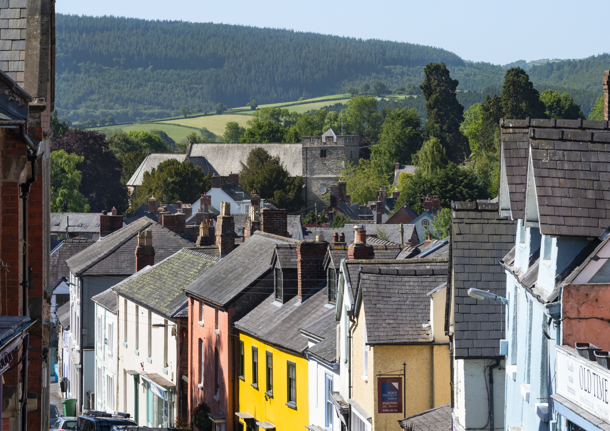The view down High Street towards St John The Baptstist's Church, Bishop's Castle, Shropshire.
